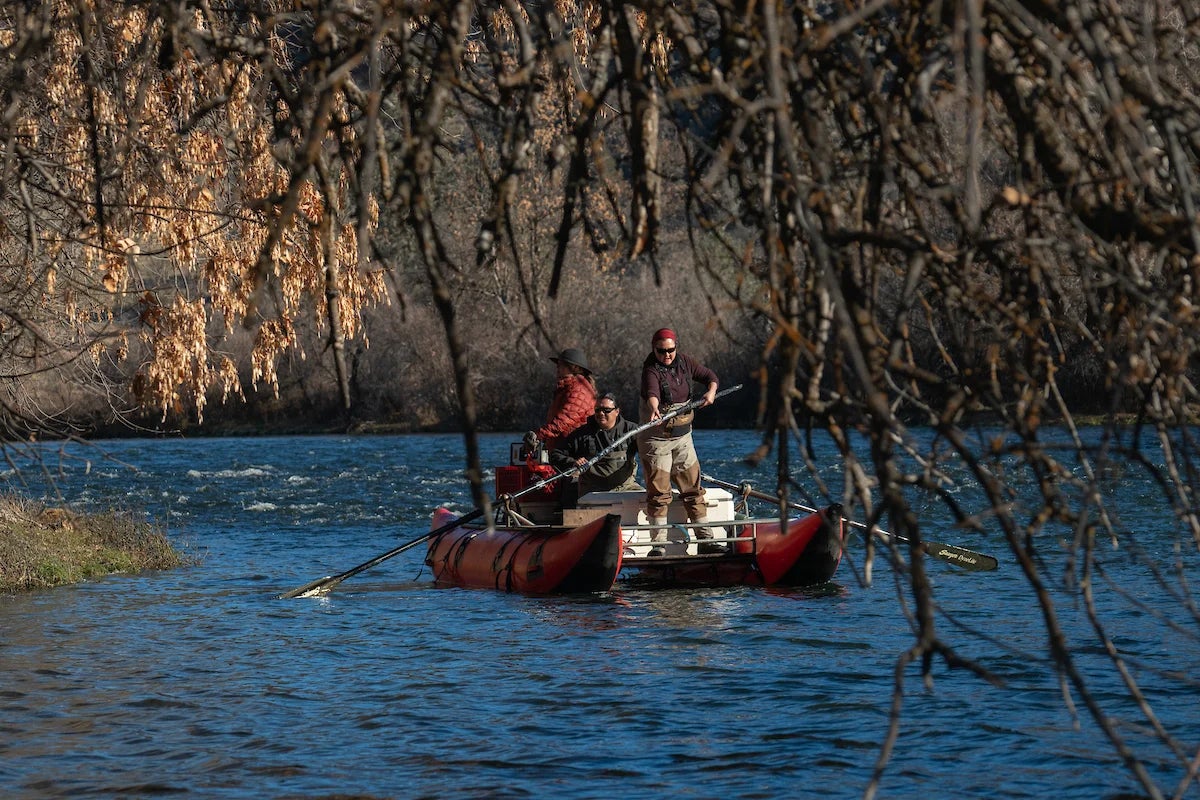 people on a boat on a river
