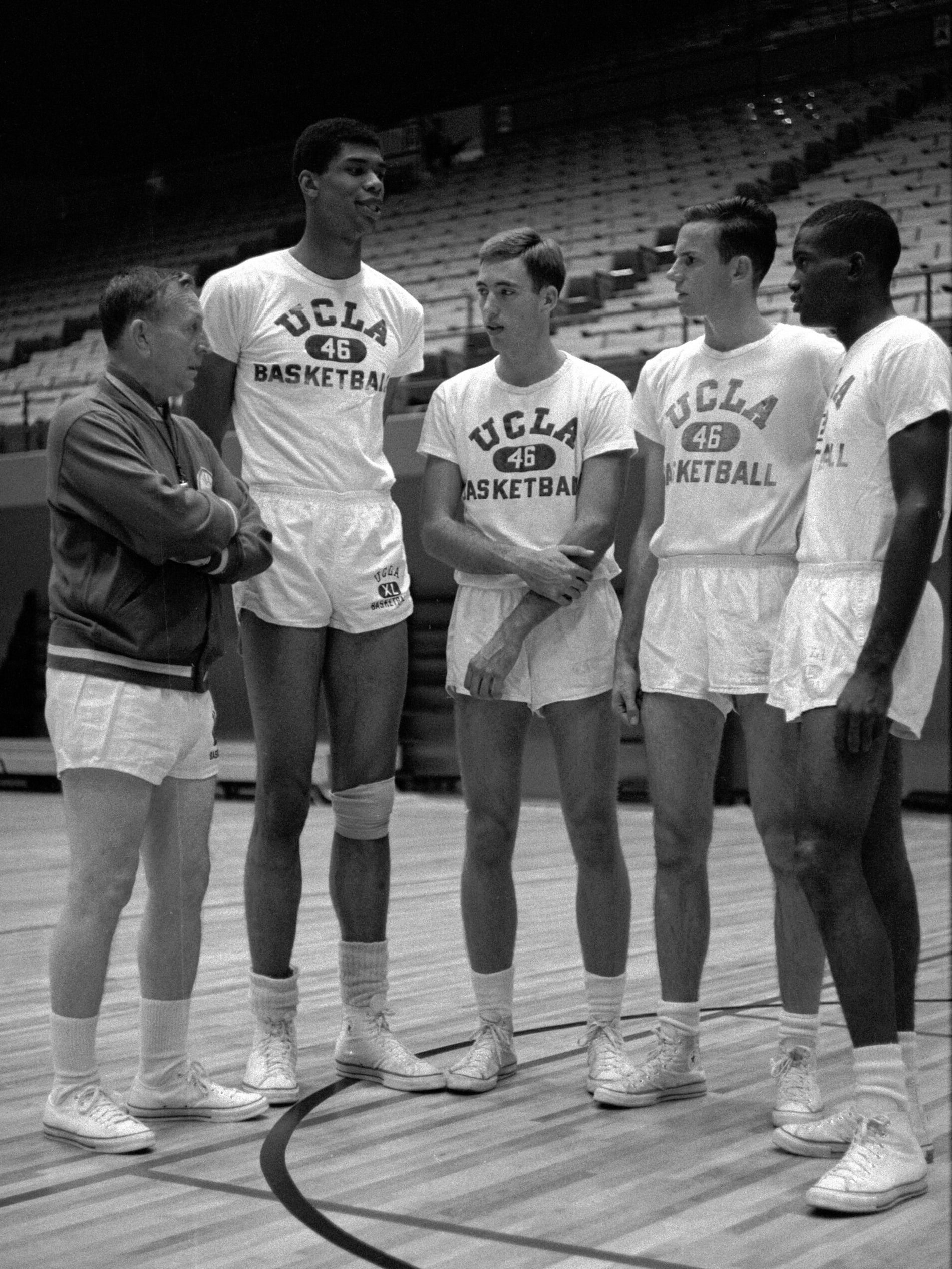 1960s photo of UCLA basketball coach John Wooden with four freshman All-American recruits: Lew Alcindor (later Kareem Abdul-Jabbar), Lynn Shackleford, Kenny Heitz, and Lucius Allen