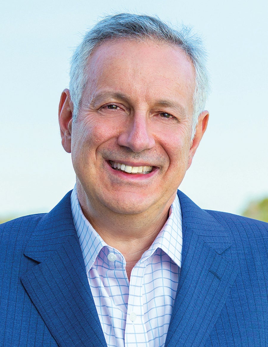 Man smiling with blue jacket