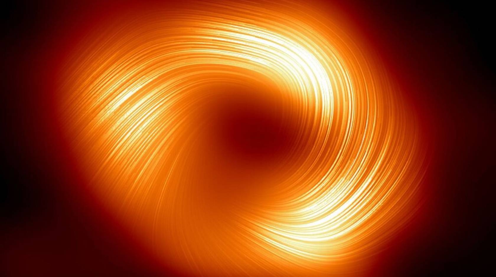 A swirl of yellow-red light against a black background